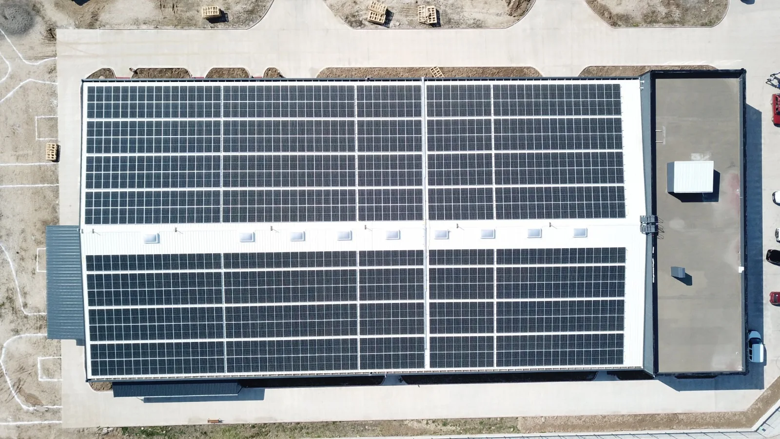Drone view from above of the Erbaa factory roof, covered in solar panels
