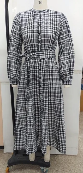 Sample of a black and white check shirt dress with a tie belt on a fitting mannequin