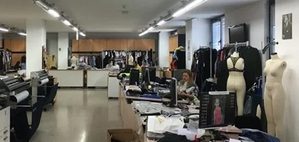 The Darsateks product development studio: desks, fabric rolls and fitting mannequins